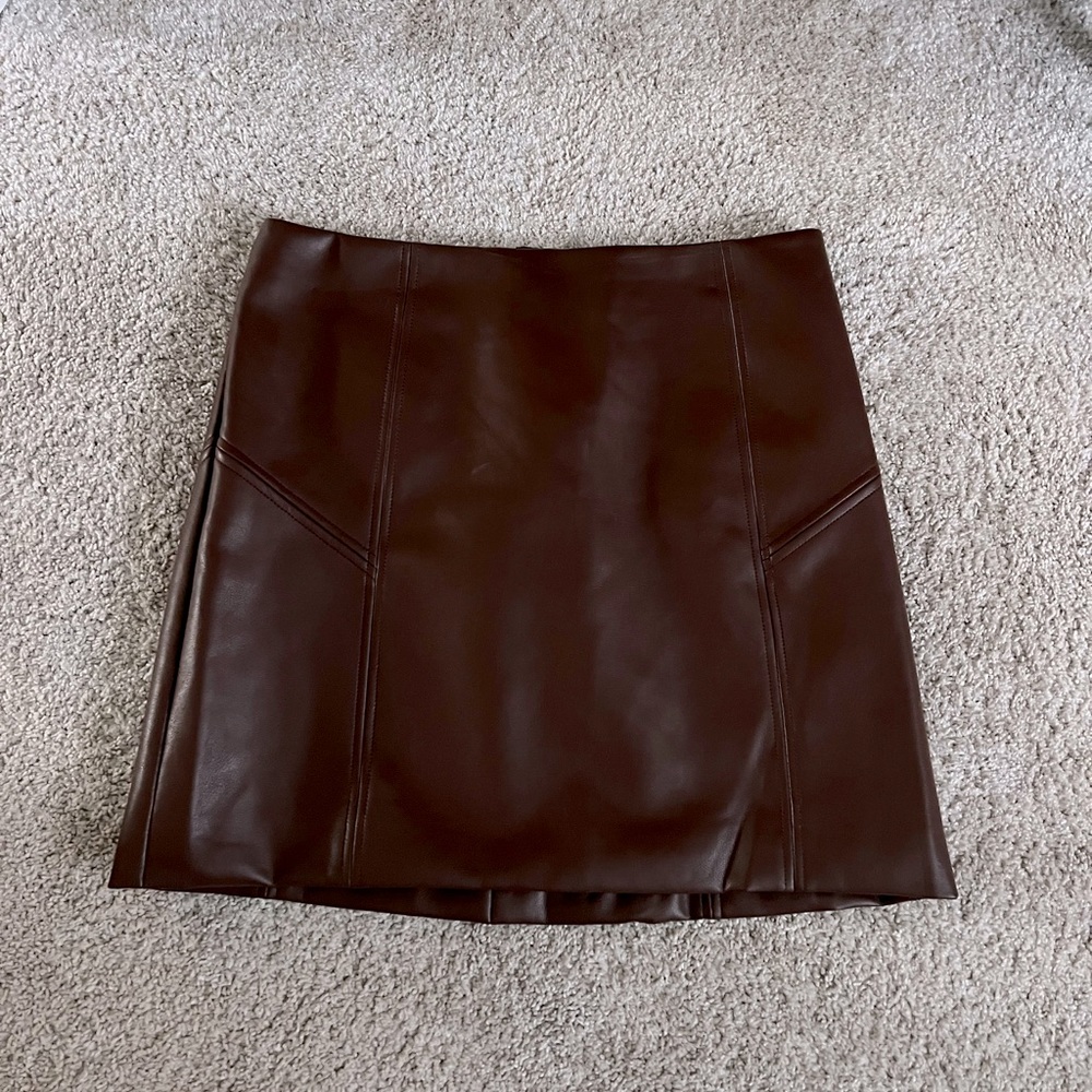 Cute faux brown leather mini skit! Fits like a size 8.